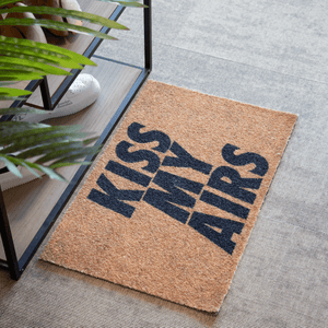 a brown and black mat with words on it