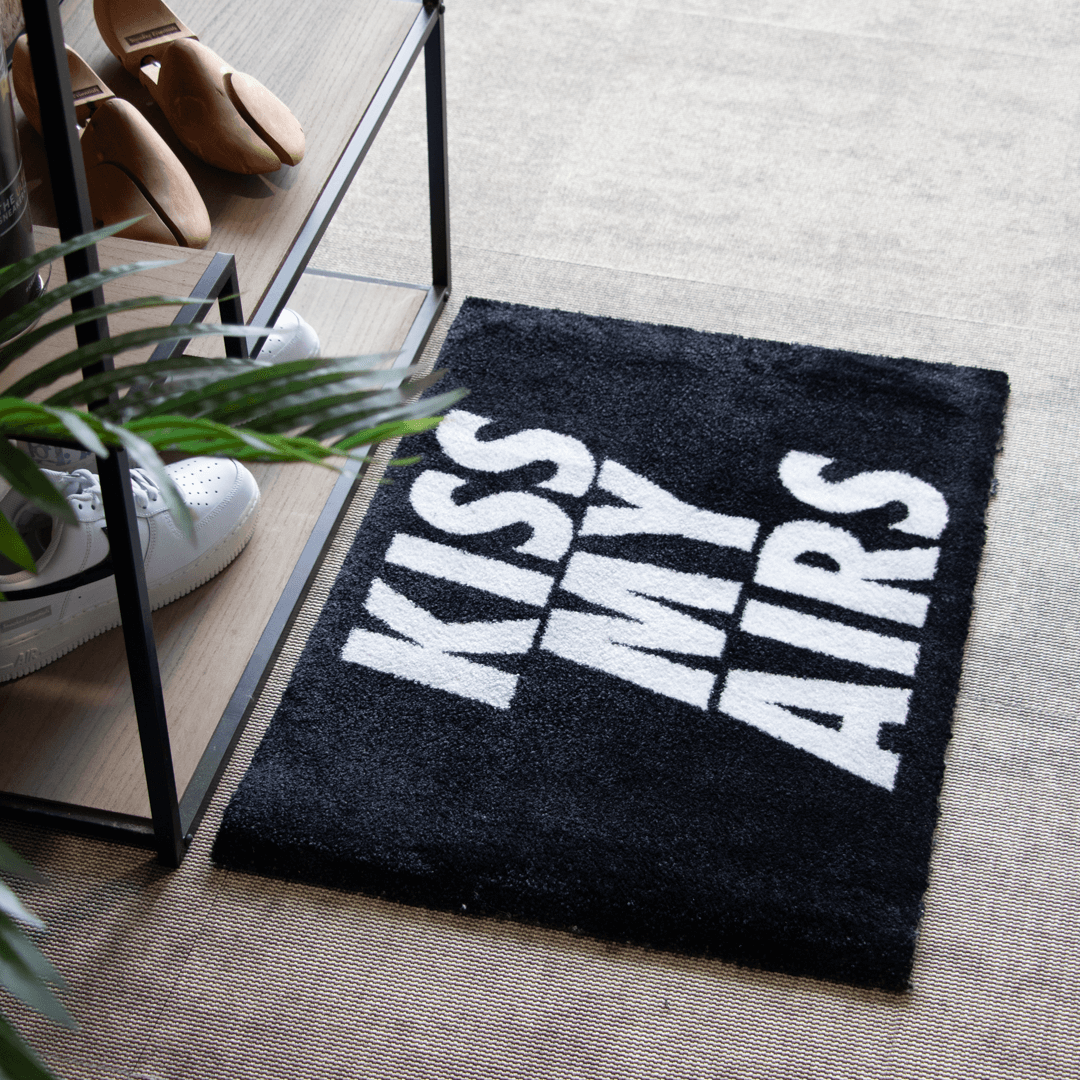 a black and white rug with white text on it